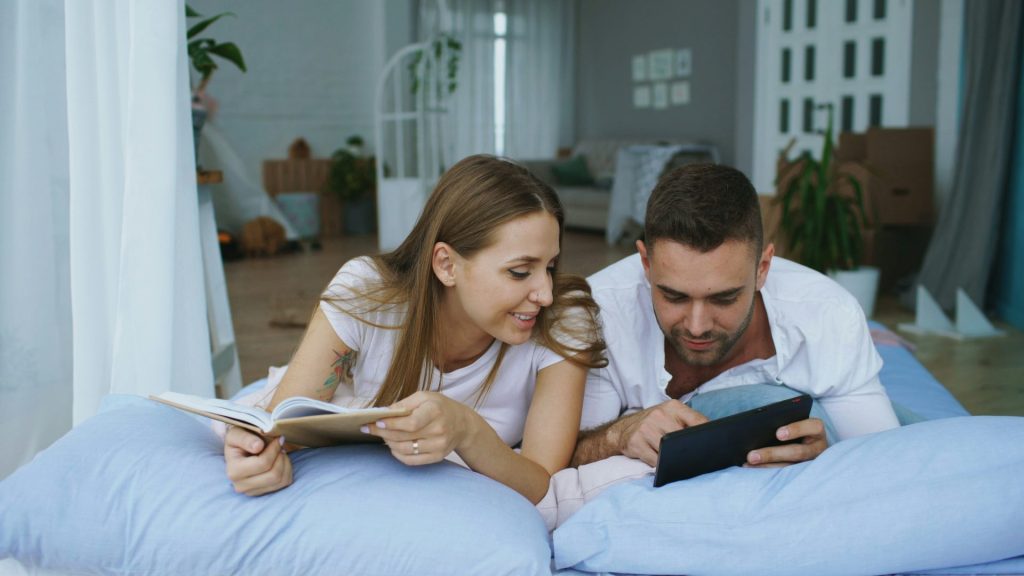 Couple reading together in bed